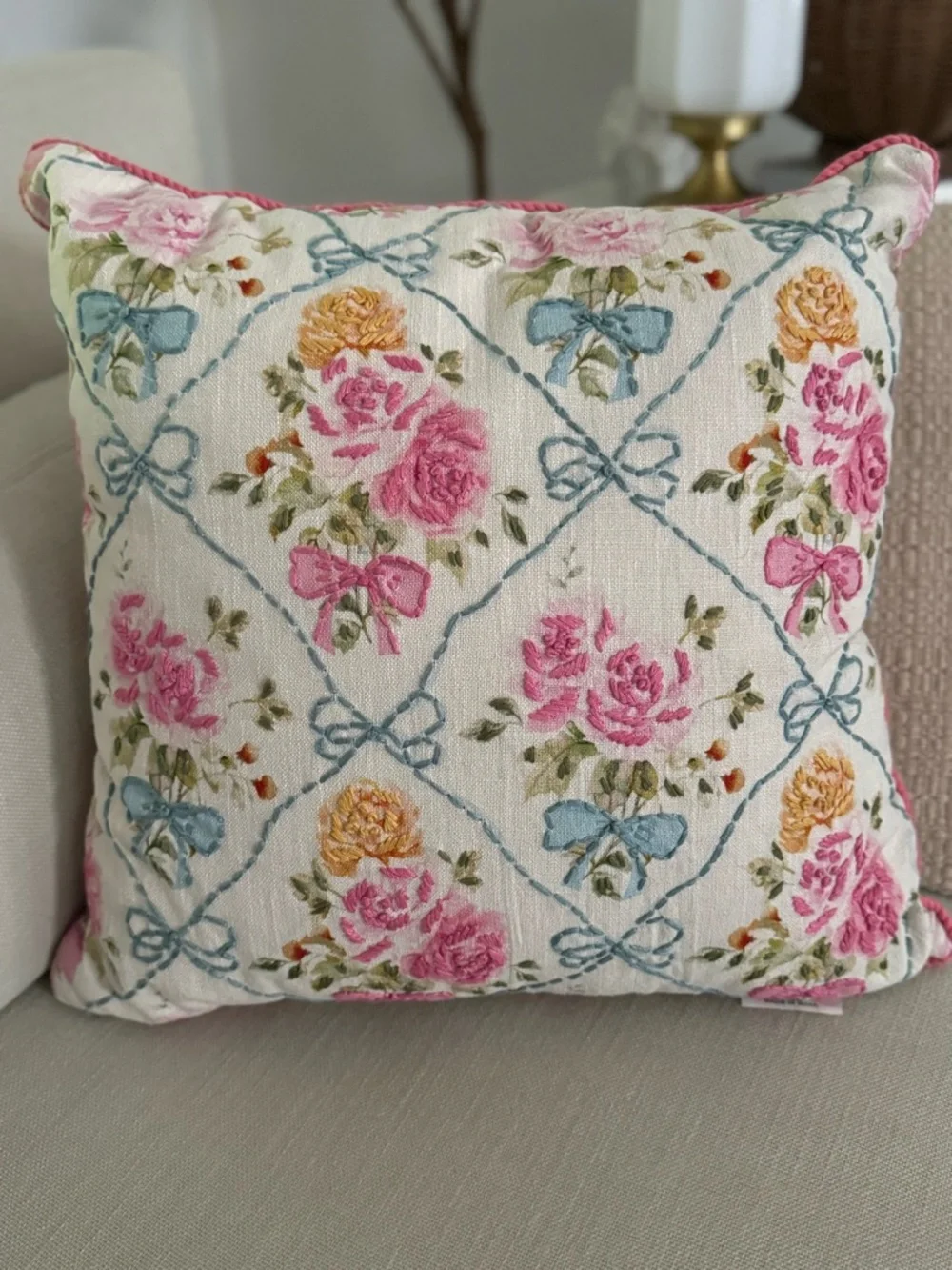 20” x 20” throw pillow features a trellis pattern with embroidered